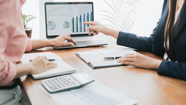 Bookkeeping consultant reviewing financial reports with an Australian small business owner